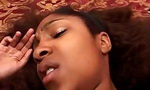 Black beauty Isyss uses her big toy while sucking dick in her bedroom