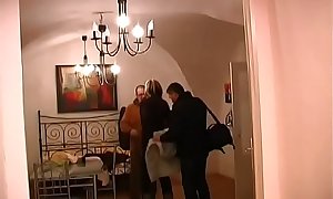 Two studs get blowjobs from mature MILF in hotel room