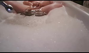 British Bbw masturbates with suction dildo in bath