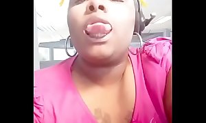 At work showing her long tongue