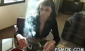 Busty bombshell enjoying a drink and a smoke whilst masturbating