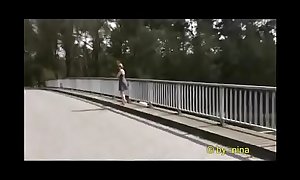 Nina flashing on a bridge