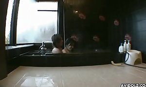 Attractive Asian gal shows her dick sucking skills in bathroom