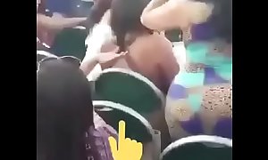 Shaking her big ass and drinking a beer